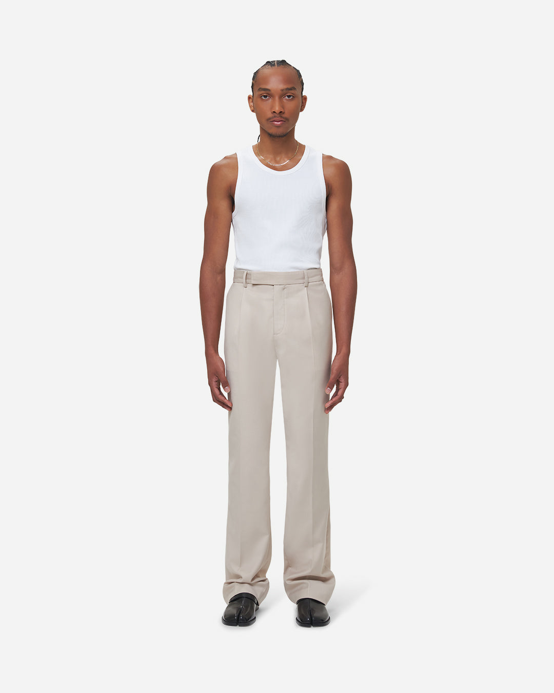 The Chesed, Antonio Tailored Trousers are cut to a unisex flare fit with a mid waist and long length. Crafted from a cotton blend with pressed creases.