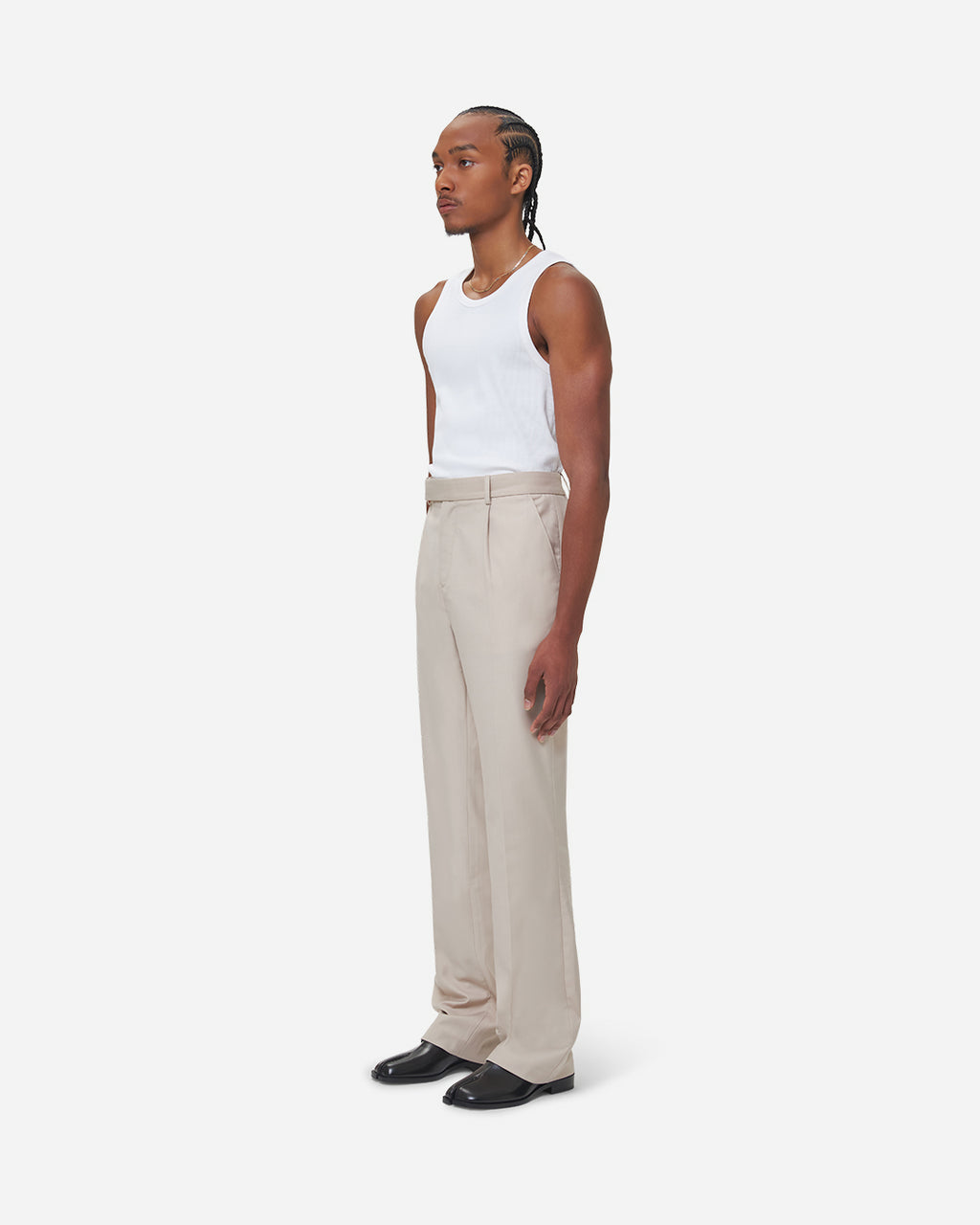 The Chesed, Antonio Tailored Trousers are cut to a unisex flare fit with a mid waist and long length. Crafted from a cotton blend with pressed creases.
