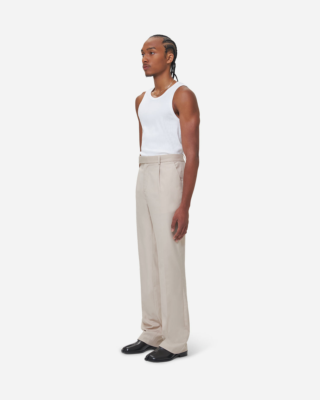The Chesed, Antonio Tailored Trousers are cut to a unisex flare fit with a mid waist and long length. Crafted from a cotton blend with pressed creases.